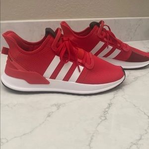 Unisex red adidas shoes